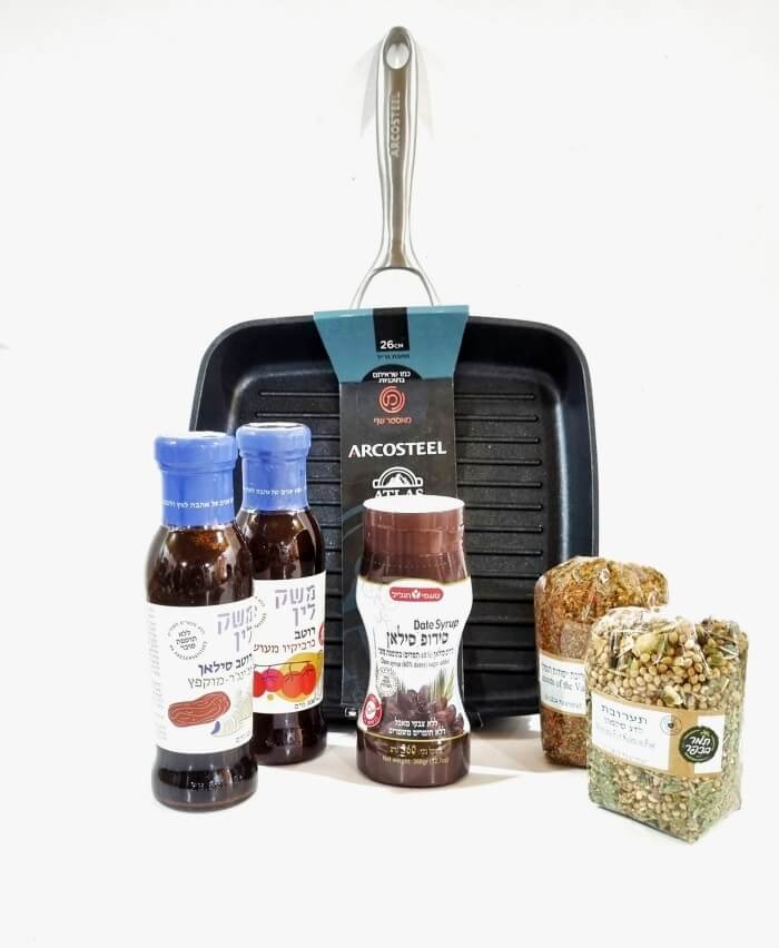 Eretz Silan is a holiday package containing a grill pan, sauces, and spices.
